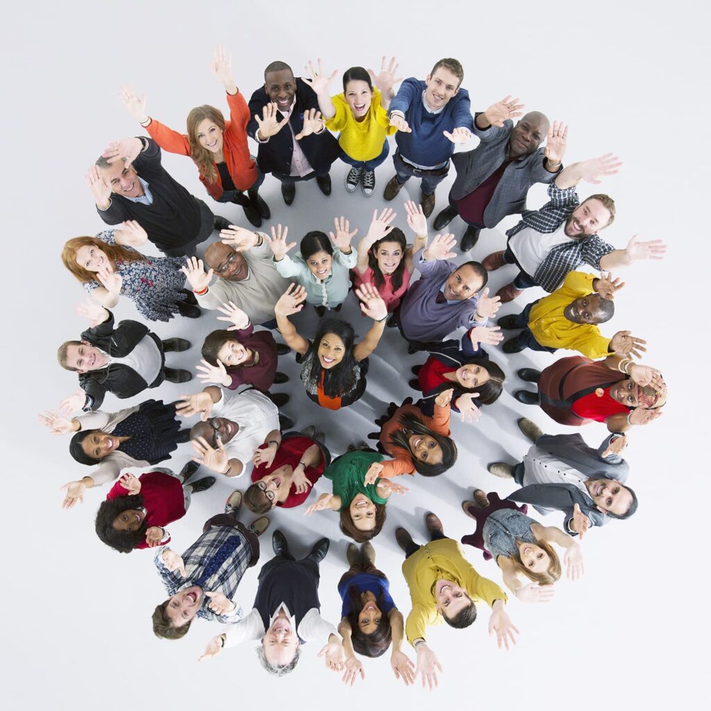 group of people standing in a circle looking up